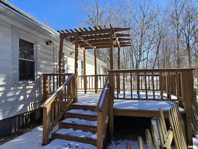 snow covered deck featuring a pergola