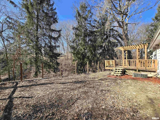 view of yard with a pergola and a deck