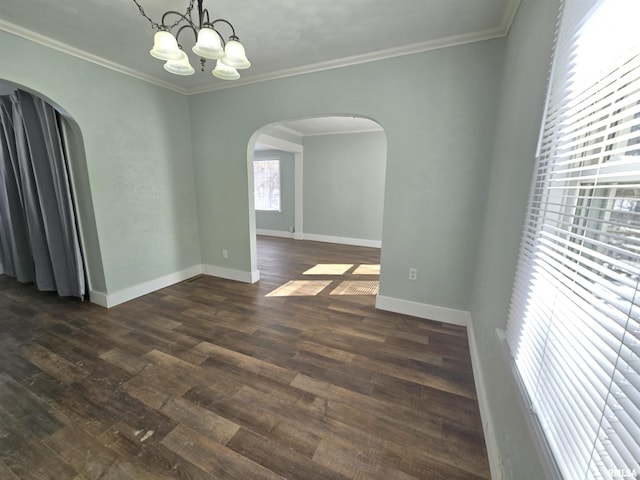 unfurnished dining area featuring baseboards, arched walkways, dark wood-style flooring, and ornamental molding