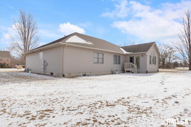 view of snow covered property