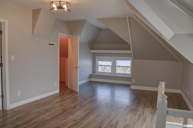 644 S Randolph St, Macomb, IL 61455 - bonus room with vaulted ceiling, an inviting chandelier, wood finished floors, and baseboards