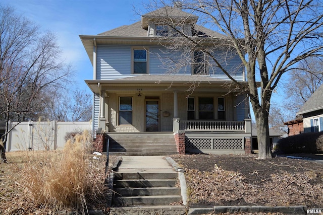 644 S Randolph St, Macomb, IL 61455 - american foursquare style home with a shingled roof, covered porch, and fence
