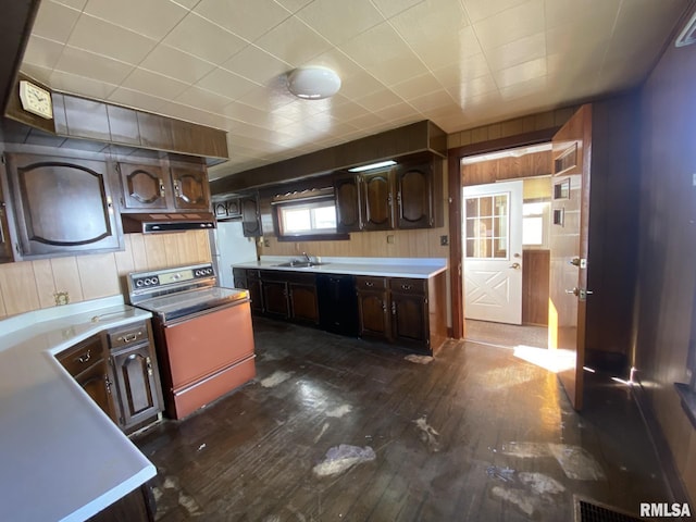 kitchen with dark brown cabinetry, black dishwasher, stove, dark wood-style flooring, and a sink