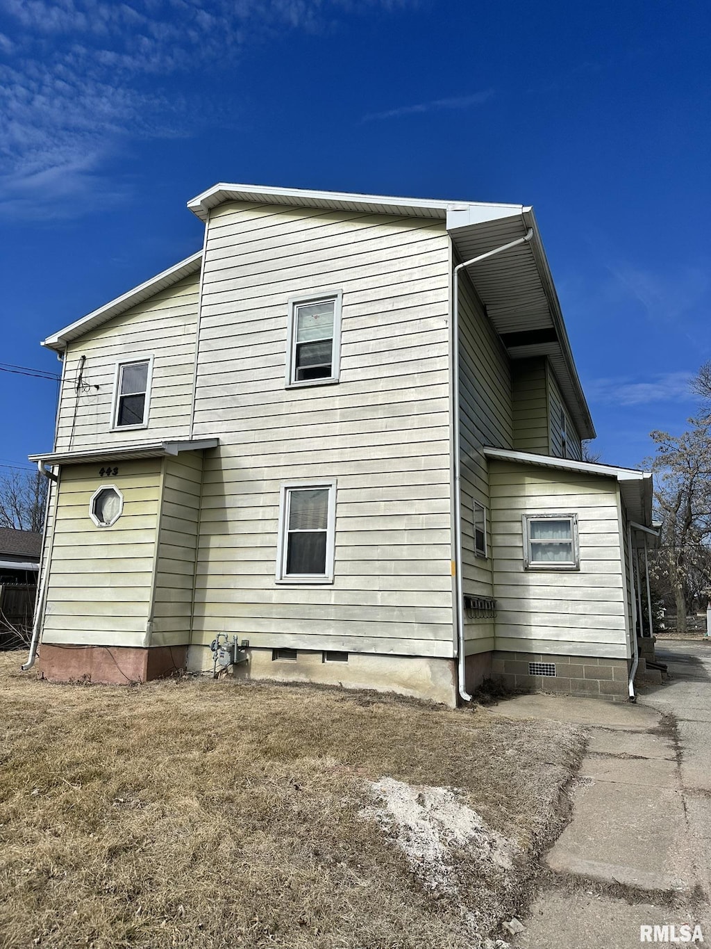 rear view of house with crawl space