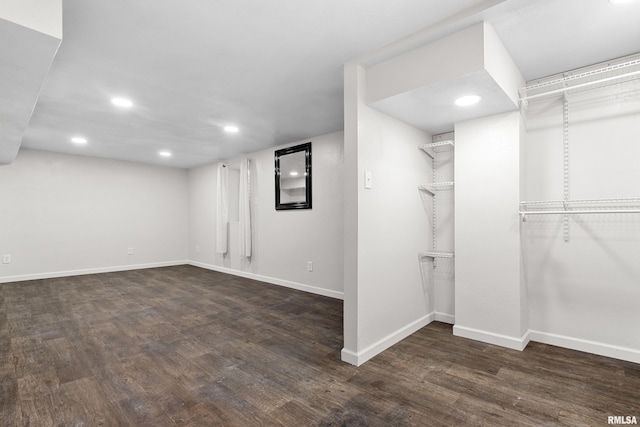 basement with dark wood-type flooring, recessed lighting, and baseboards