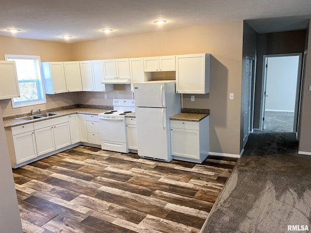 kitchen with dark wood-type flooring, white cabinets, a sink, white appliances, and under cabinet range hood