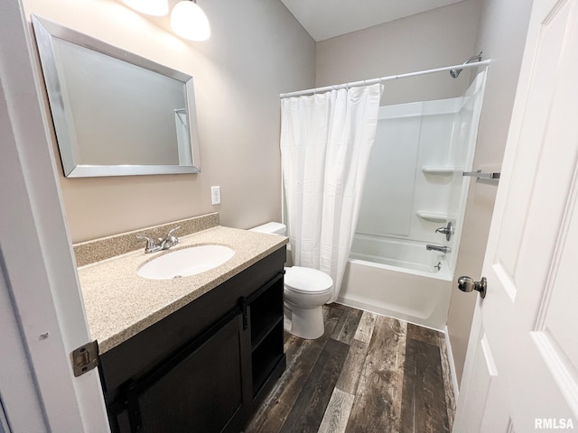 full bathroom featuring toilet, shower / tub combo, wood finished floors, and vanity