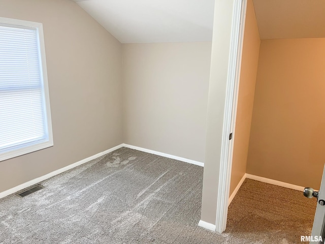 bonus room featuring lofted ceiling, baseboards, visible vents, and carpet flooring