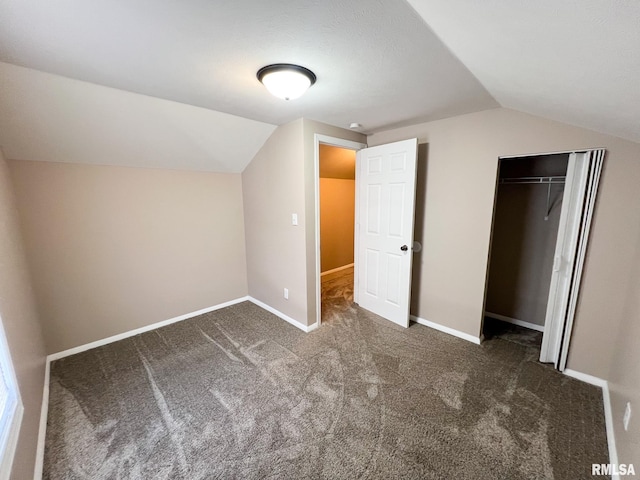 additional living space featuring baseboards, vaulted ceiling, and carpet flooring