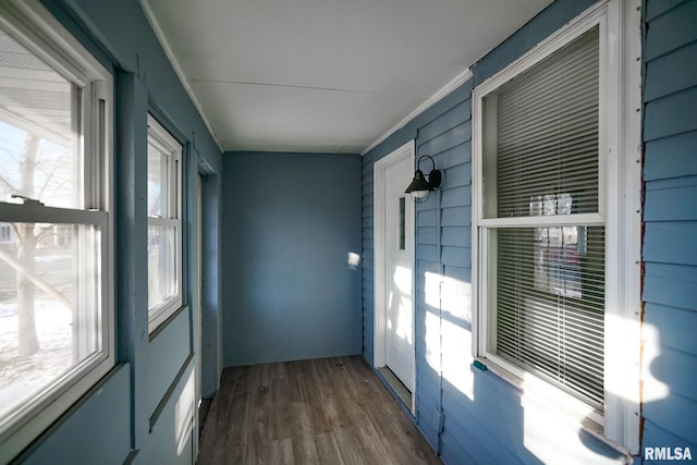 unfurnished sunroom featuring a wealth of natural light