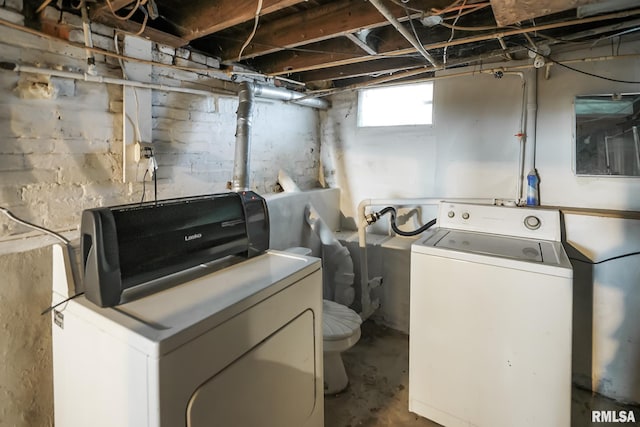 laundry area featuring laundry area and washer and clothes dryer