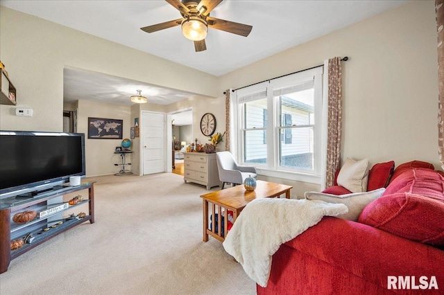 living room with light carpet and a ceiling fan