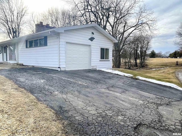 exterior space with aphalt driveway