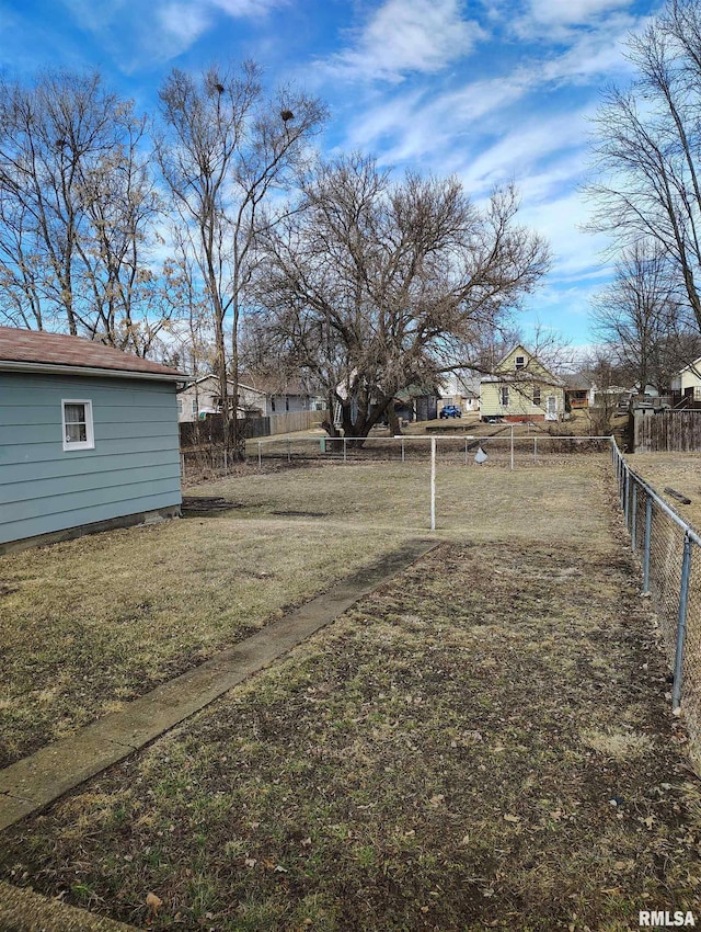 view of yard with fence and a residential view