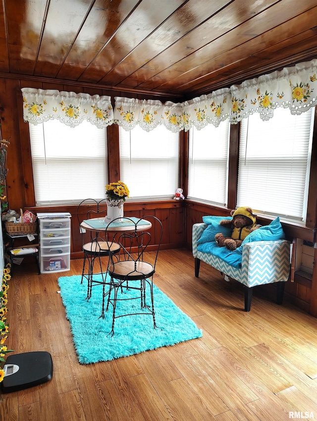 dining area featuring wood finished floors and wood ceiling