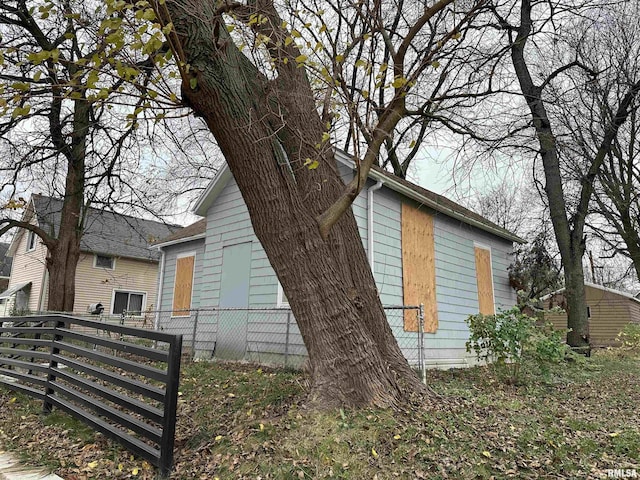 view of home's exterior with fence