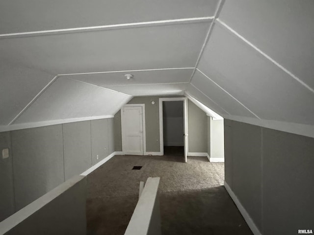 bonus room with lofted ceiling and carpet floors