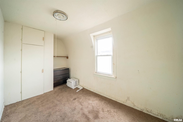 unfurnished bedroom featuring light carpet