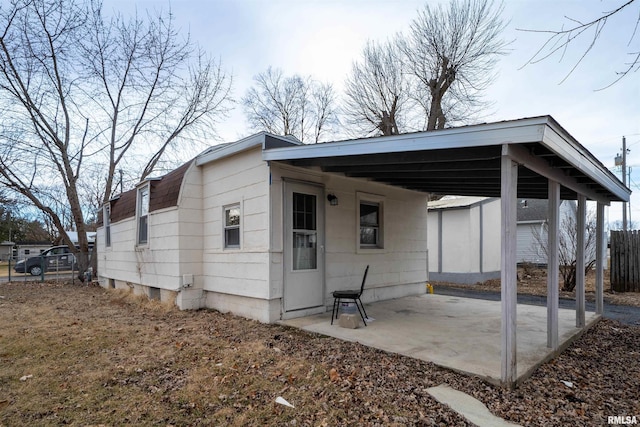 exterior space featuring a patio area and fence