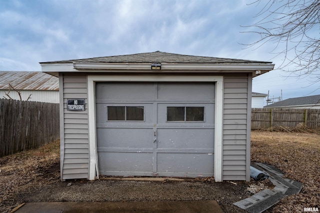 detached garage with fence