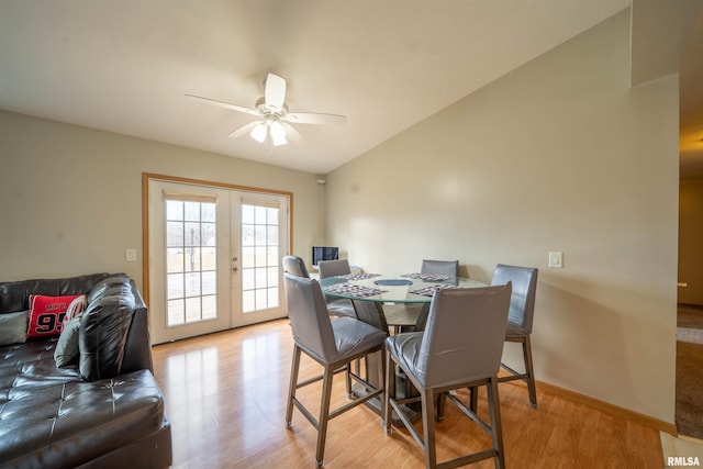 dining space featuring light wood-type flooring, ceiling fan, lofted ceiling, and french doors