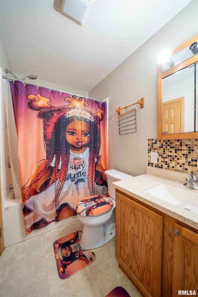 full bathroom with tile patterned flooring, toilet, vanity, backsplash, and shower / bath combo