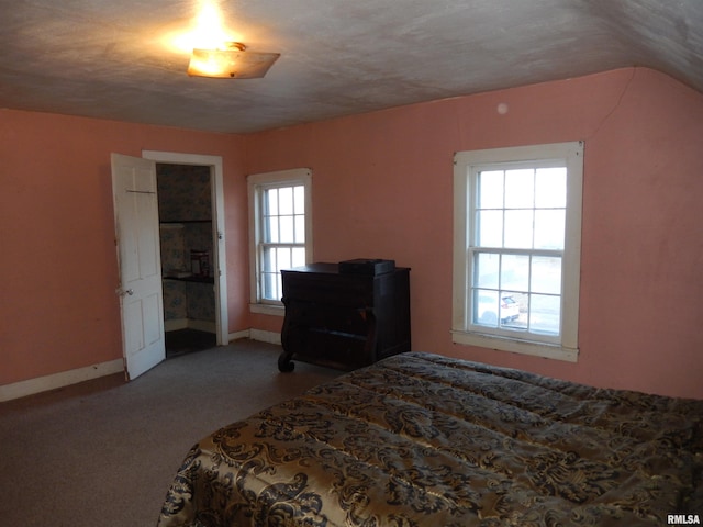 bedroom with carpet flooring and baseboards