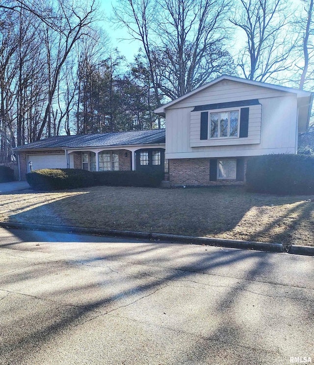 view of front of home featuring brick siding