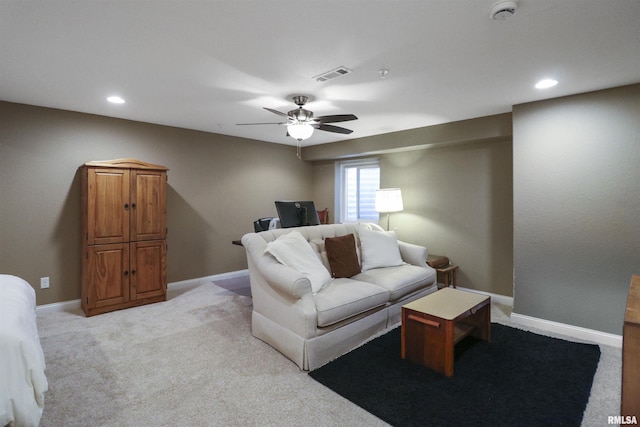 living area with light colored carpet, visible vents, baseboards, and recessed lighting