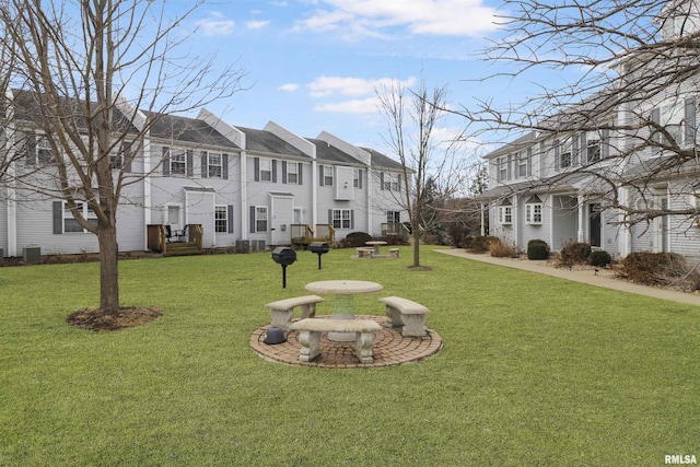 exterior space with a residential view and a yard