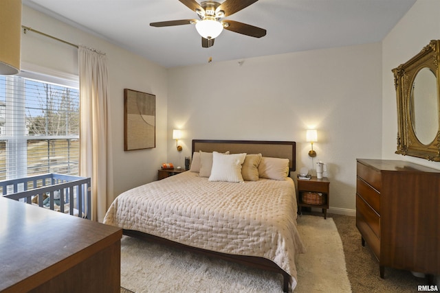 bedroom featuring carpet, a ceiling fan, and baseboards