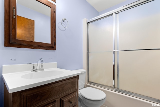 full bathroom with shower / bath combination with glass door, vanity, and toilet