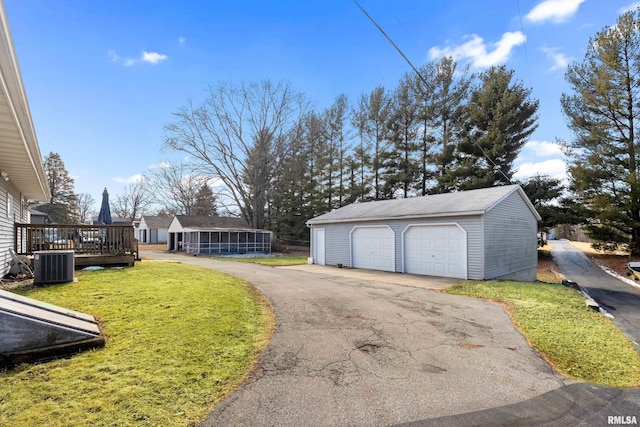 detached garage featuring cooling unit