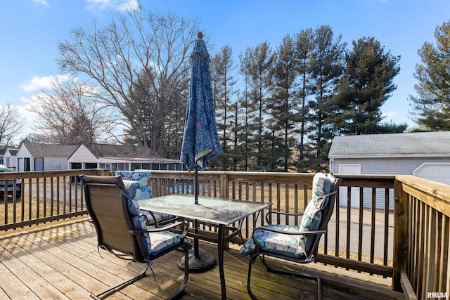 wooden terrace with outdoor dining space