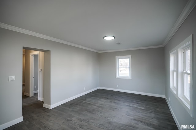 unfurnished room featuring dark wood-style floors, baseboards, and crown molding