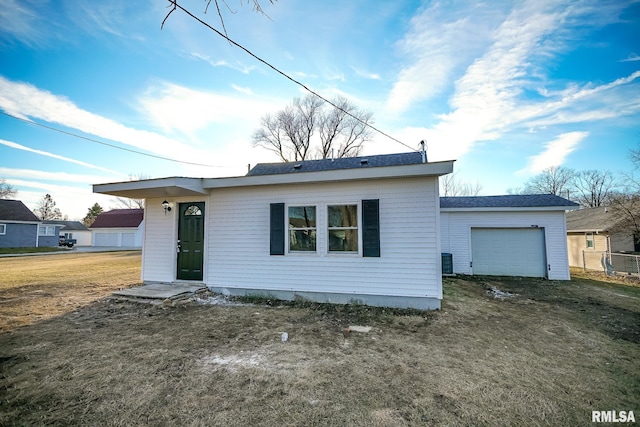 single story home featuring a front yard and central air condition unit