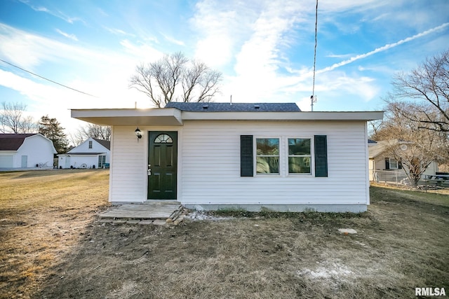 view of front of home with a front yard