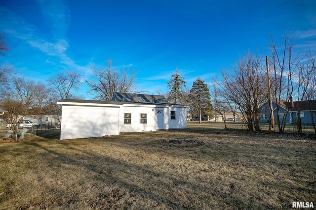 exterior space featuring a yard and fence