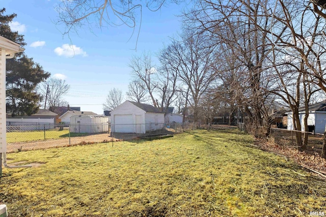 view of yard with a fenced backyard and an outdoor structure