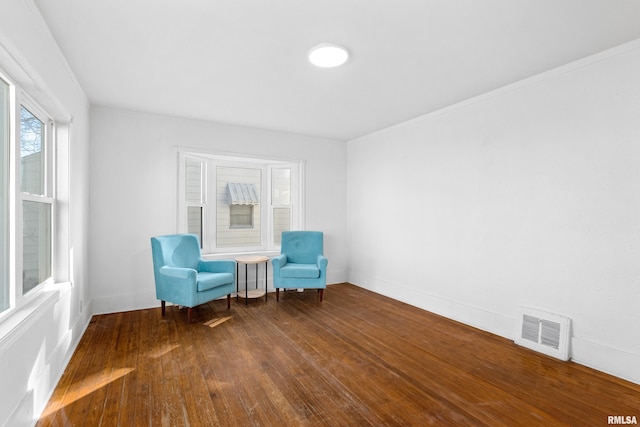 unfurnished room with hardwood / wood-style flooring and visible vents