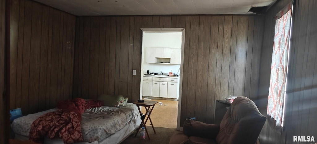 bedroom with wooden walls