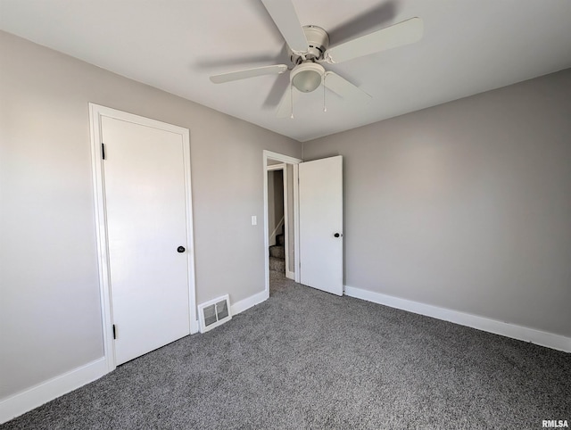 unfurnished bedroom featuring a ceiling fan, baseboards, visible vents, and carpet flooring