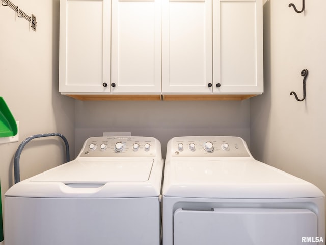 laundry area with cabinet space and washer and dryer