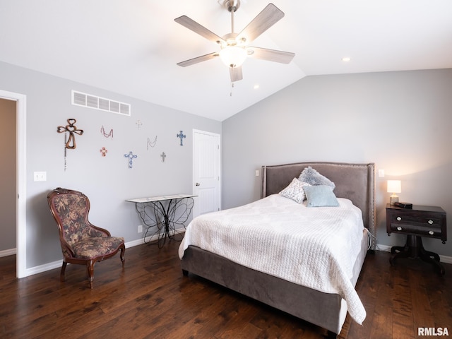 bedroom with visible vents, vaulted ceiling, baseboards, and wood finished floors