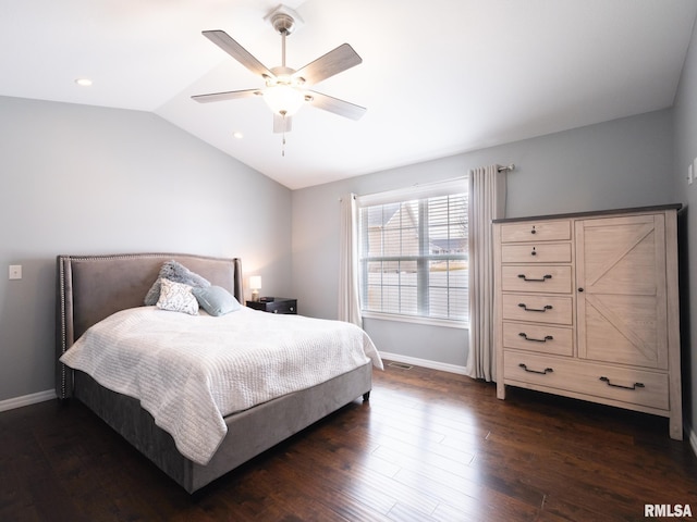 bedroom with dark wood-style floors, lofted ceiling, visible vents, ceiling fan, and baseboards