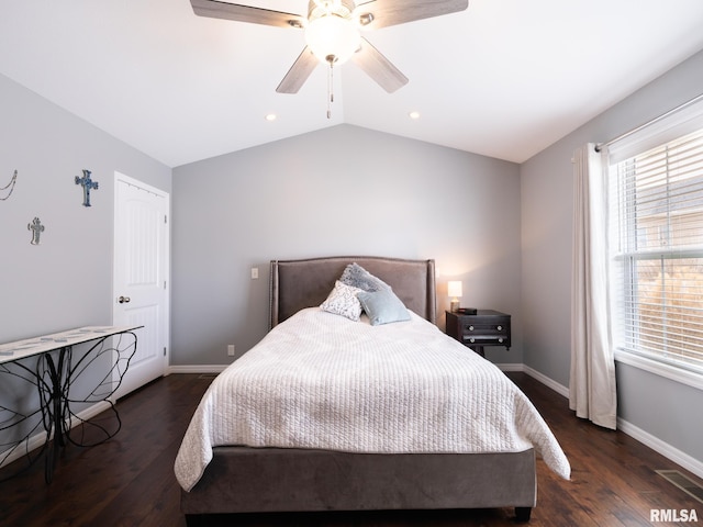 bedroom with lofted ceiling, a ceiling fan, baseboards, and wood finished floors