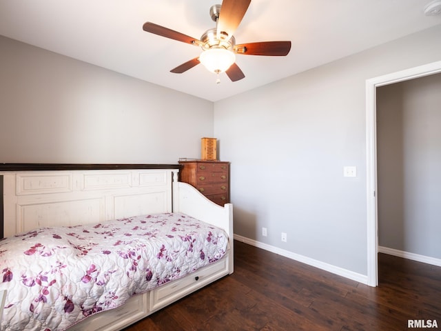 bedroom featuring dark wood-type flooring, ceiling fan, and baseboards