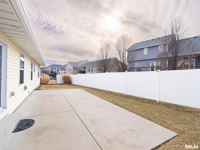 view of patio with a residential view and a fenced backyard