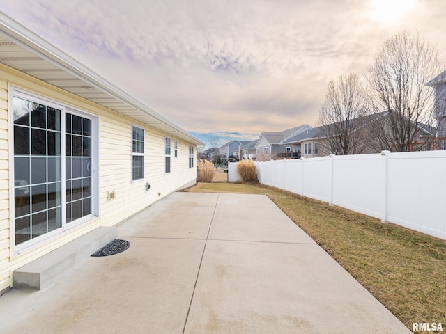 view of patio / terrace featuring a fenced backyard and a residential view