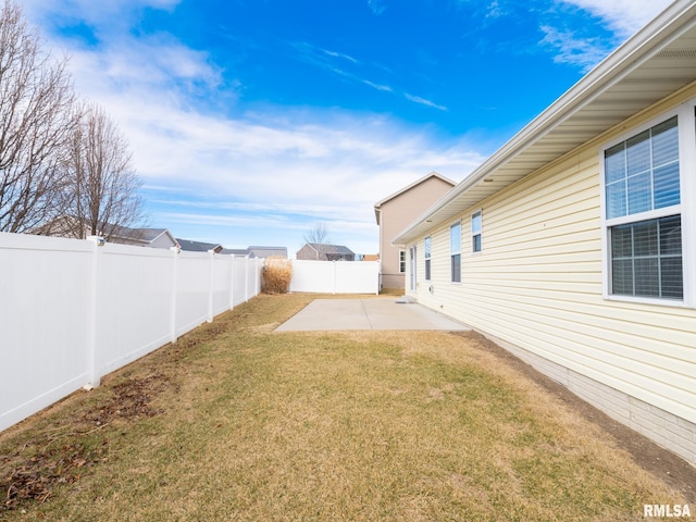 view of yard featuring a patio area and a fenced backyard